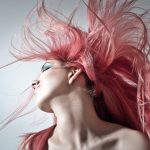 Woman flipping her pink hair