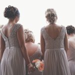bridesmaids wearing purple dresses