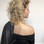 Sandy from grease hair tutorial on a blond woman wearing an off the shoulder black top and black leather jacket