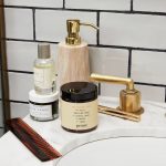 Prose product still on sink with comb and other beauty products