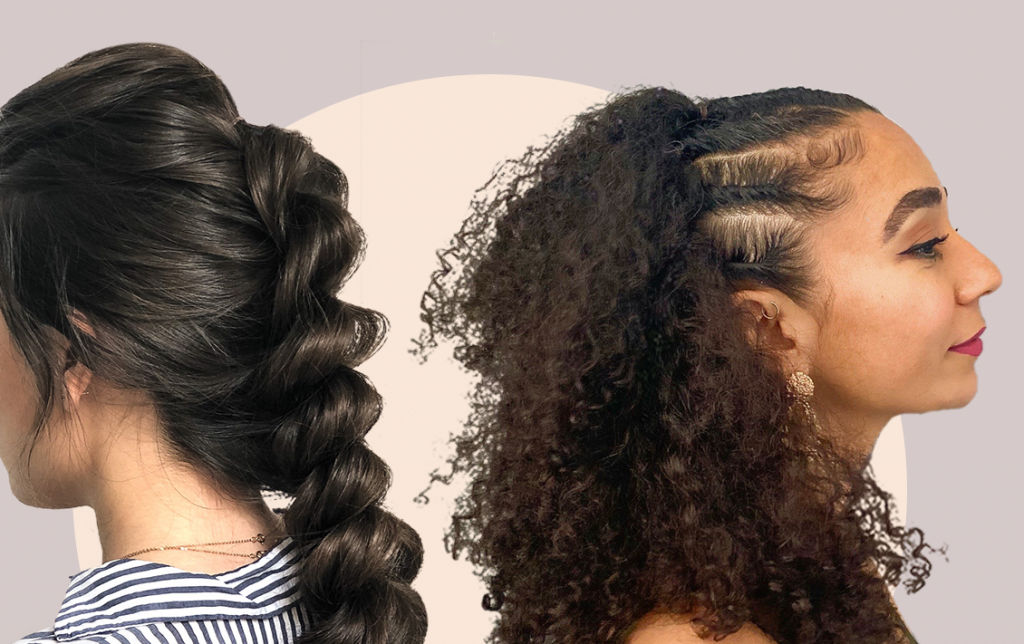 woman with her brown hair braided stands back to back with a woman with curly hair