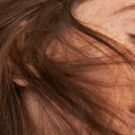 close up portrait of woman with freckles and auburn hair