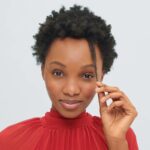 woman with coily hair shows off her shrinkage
