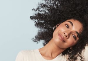 woman with dark, curly hair