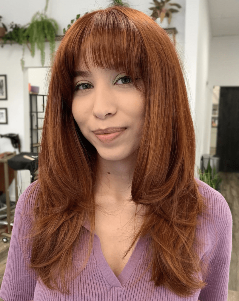 woman with straight, copper hair
