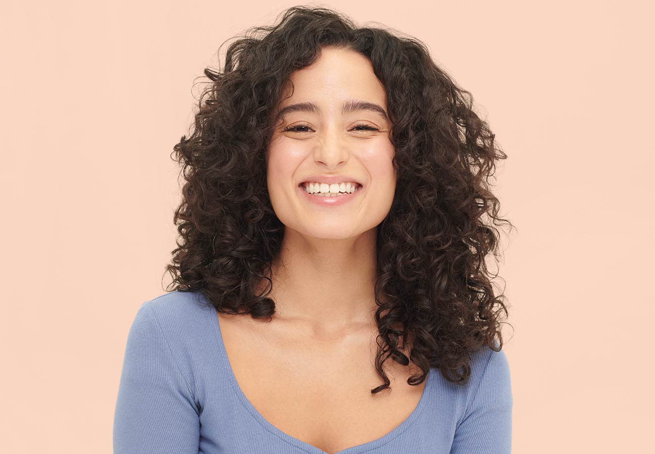 woman with dark, curly hair