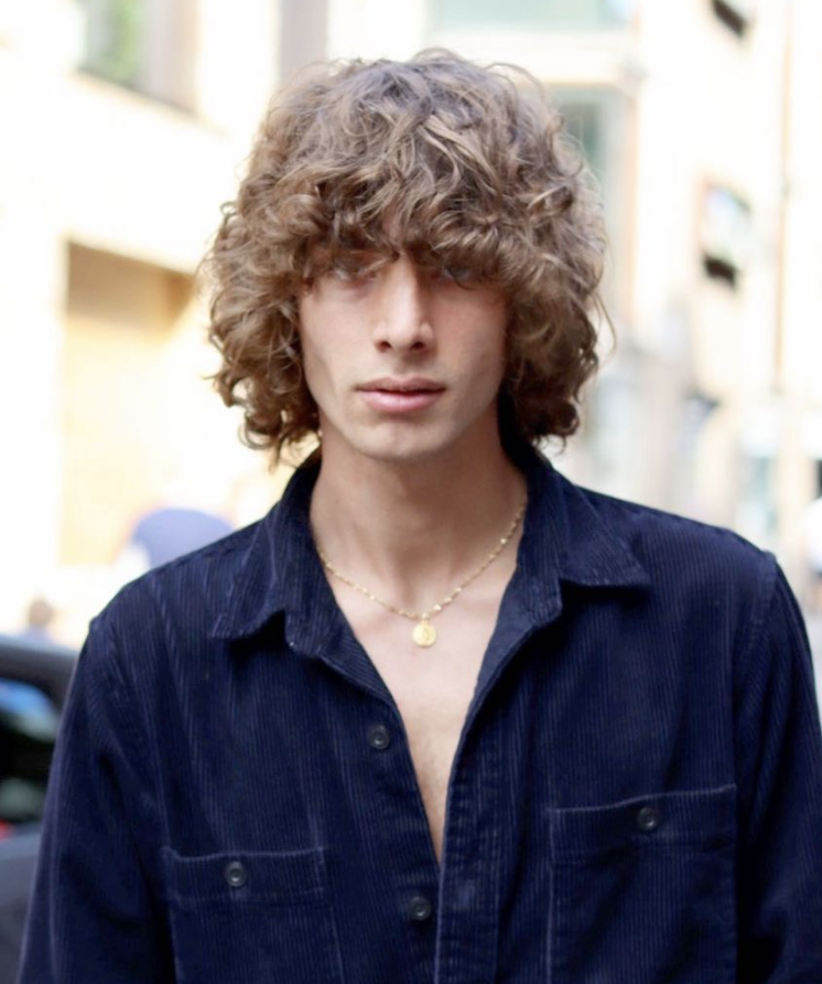 man with curly, brown hair