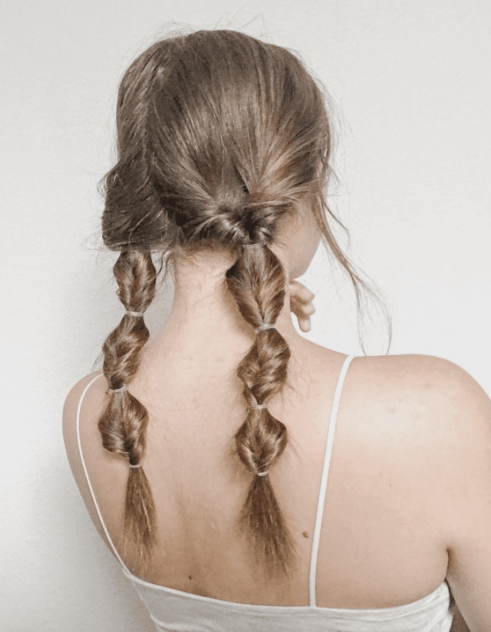 9 Workout Hairstyles for Surviving the Sweatiest Gym Sesh