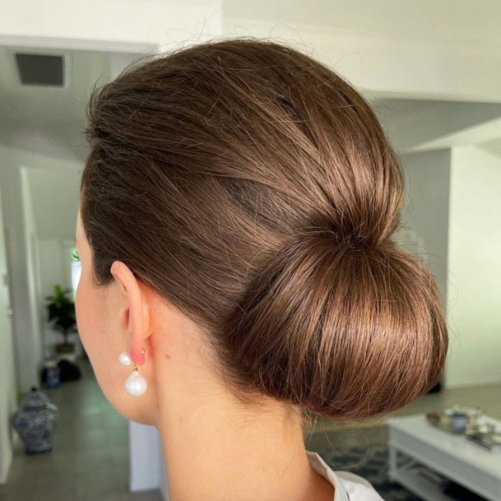 Brush Ltd - Relaxed side bun for our gorgeous wedding guest client...  Perfect hair style for hats and fascinators ✨ . . . . . . #weddingguest # hairstyle #updo #sidebun #relaxedstyle #hair #