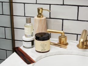Prose product still on sink with comb and other beauty products