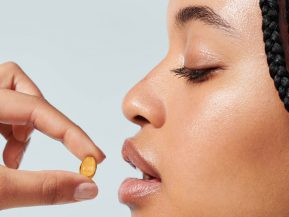 woman taking hair vitamins